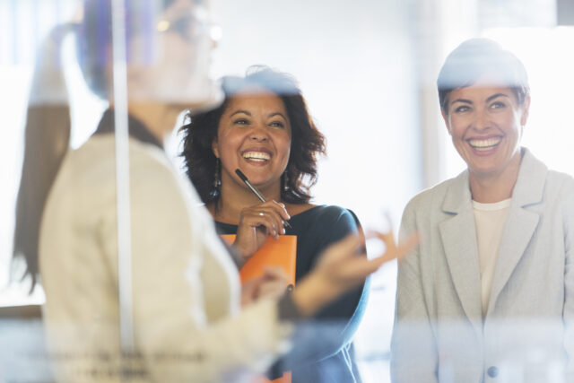 Women working and laughing